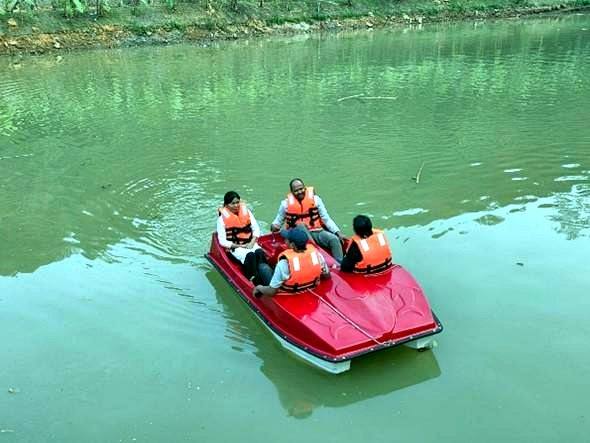 Guests paddle-boating on the water body